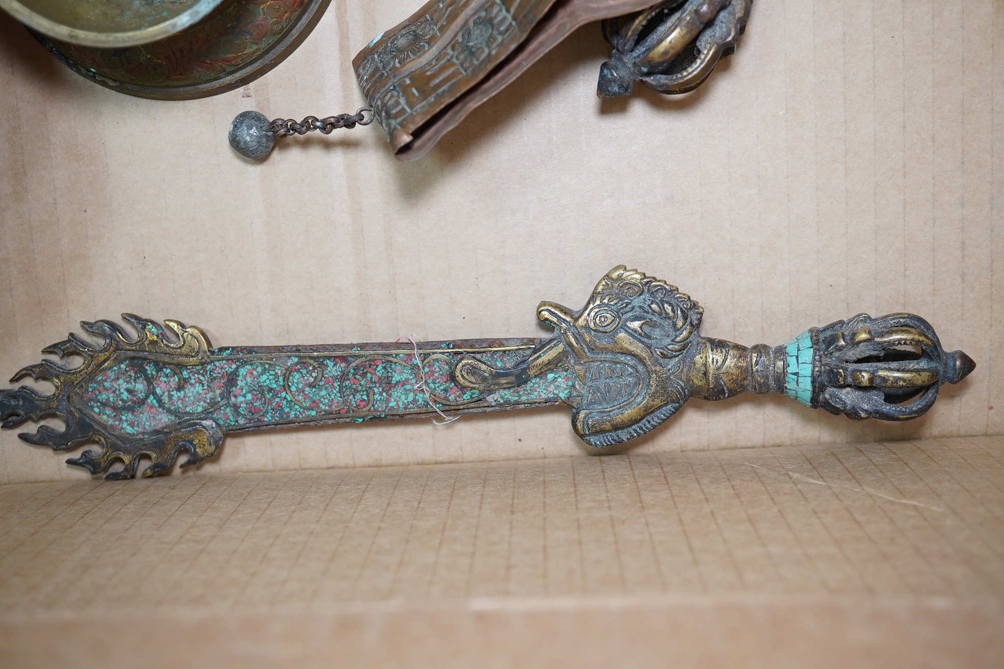 A group of Tibetan brass and mixed metal artefacts to include a brass vase with cabochon inset stones and figures of deities, largest 22cm high. Condition - mostly fair